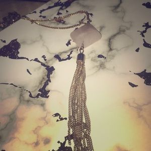 pink diamond with chain at bottom it’s a necklace